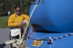 Andi Parrott belts down the boats after a day on the river (Photo by Philip Hall / University of Alaska Anchorage).