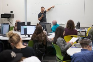 Professor Tom Harman conducts the first session of an ALEKS-based Math 105 class in UAA's new Math Emporium, located in the Learning Resources Center at Sally Monserud Hall. (Photo by Philip Hall/UAA)