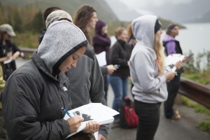 Yosty Storms, left, and classmates took notes on their outdoor classroom along Turnagain Arm (Photo by Philip Hall / University of Alaska Anchorage). 