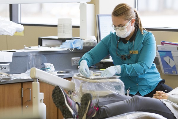 UAA student Ellen Holt prepares to work with a patient during a dental hygiene clinical class at the UAA Allied Health Building. Holt will take part in next week's Dental Days event, March 24-25, which helps people without dental insurance who can't afford dental care. (Photo by Philip Hall / University of Alaska Anchorage)