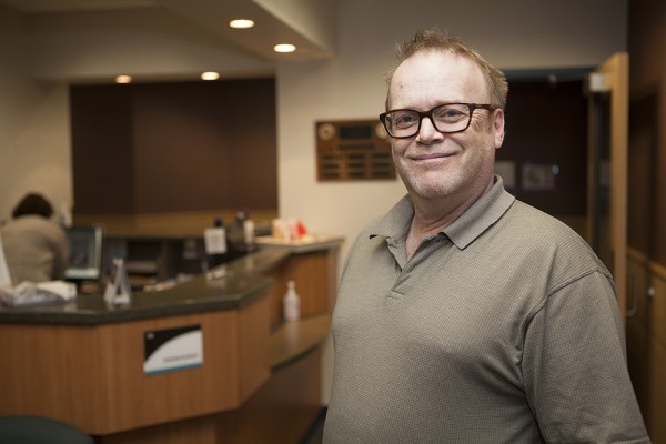 Tom Jonas, a chef who works at a restaurant in Wasilla, says he is happy with the care he's been receiving from UAA dental hygiene and dental assistant students. Jonas does not have health insurance and says he couldn't otherwise afford to access deep-cleaning care for his teeth. (Photo by Philip Hall / University of Alaska Anchorage)