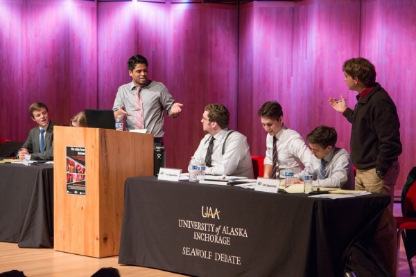Jacob Tatum faces down the literal opposition in the finals of this year's Cabin Fever Debates (Photo by Jacob Shercliffe, Seawolf Debate).
