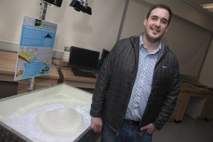I AM UAA: Graduating senior David Parret built an augmented reality sandbox, at left, to increase the visibility of the geomatics department (Photo by Phil Hall / University of Alaska Anchorage).