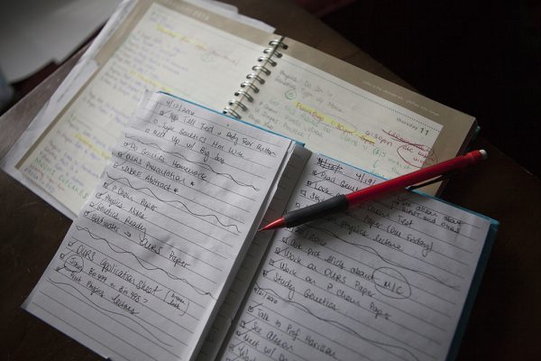 The UAA Multicultural Center's AHAINA program chose Kenyon Wright and Chelsea Parrocha as its 2016 Man and Woman of Excellence. Here is a photo of the planners Chelsea uses to manage her frenetic schedule. (Photo by Philip Hall / University of Alaska Anchorage)