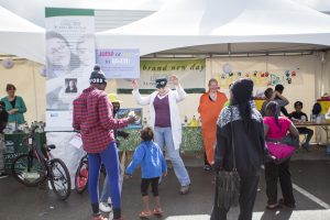 Families stroll the Mountain View Street Fair and World Refugee Day event at Clark Middle School on June 11 (Photo by Ted Kincaid / University of Alaska Anchorage).