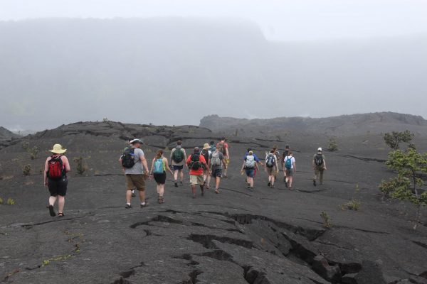 Students in Terry Naumann's volcanology course trek to a 400-foot deep crater on the east flank of the Mauna Ulu shield volcano (Photo courtesy of Jed Long).
