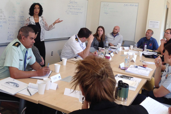 Lil Alessa, University of Idaho, led a break out group on rescue respons coordination, awareness and communications. She and Dennis Egan of Rutgers University co-facilitated the group that included Canadian and U.S. Coast Guard, researchers, industry representative and other first responders. Photo by Kathleen McCoy/UAA.