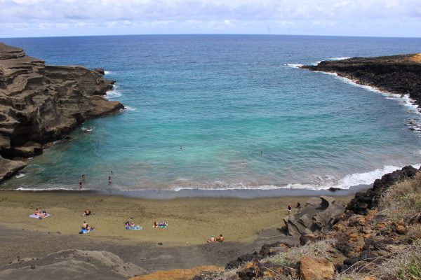 Pulverized olivine crystals built the Big Island's famous green sand beach, on the southern flanks of the Mauna Loa volcano (Photo courtesy of Jed Long).