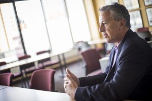 Bruce chats about his continued role at UAA from the Anchorage Chamber of Commerce boardroom (Photo by Ted Kincaid / University of Alaska Anchorage).