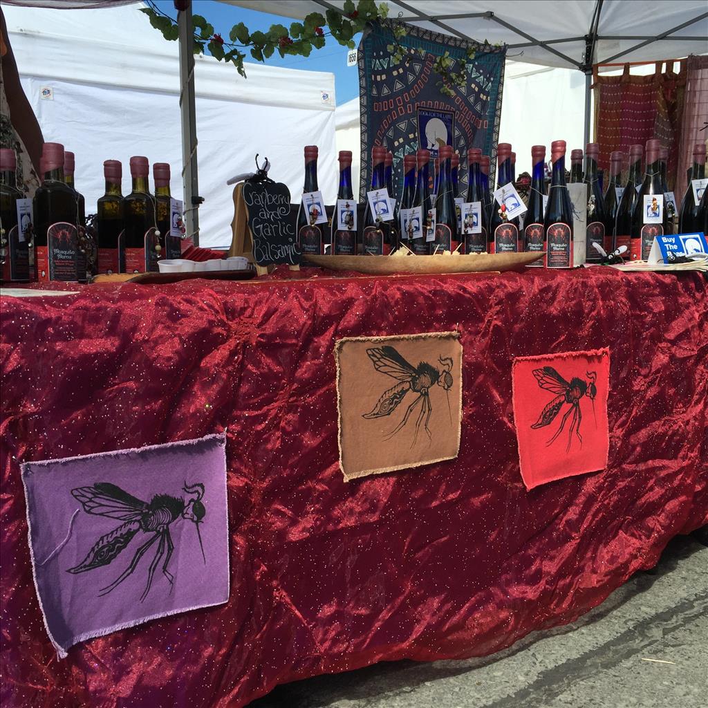 Celebrate the mosquito, if you must, at Holly's eye-catching market booth (Photo by J. Besl / University of Alaska Anchorage).
