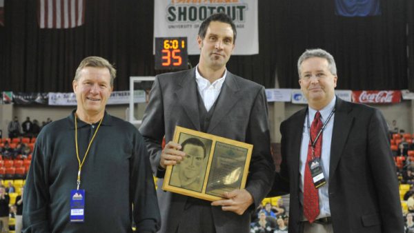 Hansi, center, accepted his Seawolf Hall of Fame plaque during the 2010 Great Alaska Shootout (Photo by Michael Dinneen / UAA Athletics).