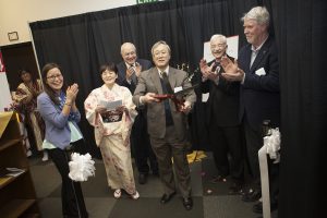 The Consul of Japan cuts the ribbon at the Tea Ceremony dedication (Photo by Phil Hall / University of Alaska Anchorage).