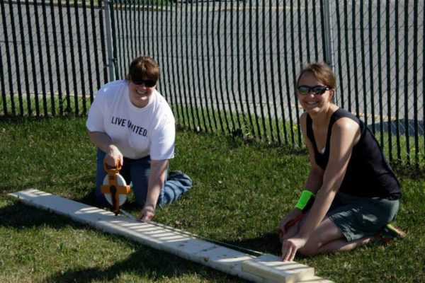 United Way of Mat-Su's Staci Manier, left, volunteers with UAA's Tracy Kalytiak at a Grow Palmer community-garden project in Palmer in 2014. (Photo courtesy of United Way of Mat-Su)
