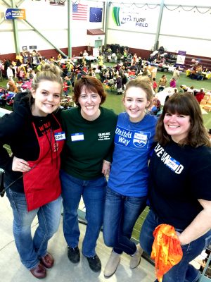 Staci Manier, right, UAA B.A. Human Services '13, serves as community impact director for United Way of Mat-Su. She organizes community coalitions like Mat-Su's Project Homeless Connect. In the photo with her are, from left, Karli Dreyer, UAA B.A. Psychology and History, '15, and UAS M.A.T., '16; Niki Pepper, a global logistics and supply chain student at Mat-Su College; and Makenna Wyatt, a United Way administrative assistant and UAA human services student. (Photo by Tracy Kalytiak / University of Alaska Anchorage)