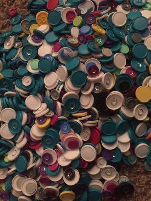 This picture shows vial caps from UAA DNP alumna Jyll Green's business in South Anchorage, myHealth Clinic. The teal-blue caps are from vials of vivitrol. (Photo by Sandi Johnson)