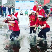 Members of UAA's Alpha Sigma Alpha take the plunge-the Polar Plunge-to raise money for Special Olympics. (Photo courtesy of Alpha Sigma Alpha)