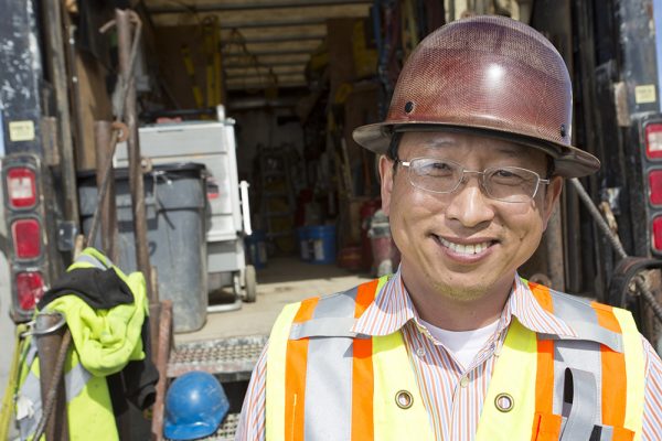 Chong Kim, a UAA civil engineering alumnus, '00, is an Alaska Department of Transportation project engineer overseeing a $55.9 million Seward Highway revamp taking place this year through 2019, between Dimond Boulevard and Dowling Road. (Photo by Theodore Kincaid / University of Alaska Anchorage)