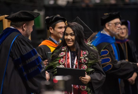 Eva Ulukivaiola accepts her diploma at UAA's Fall 2017 Commencement