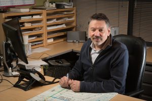 Michael Rabe '84, managing principal of CRW, at his desk