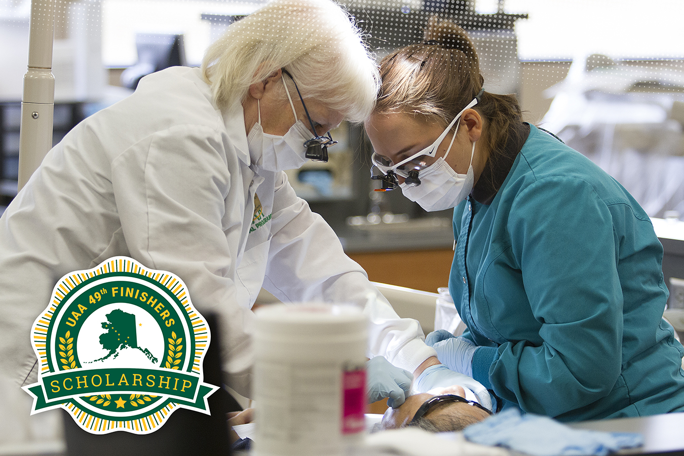 UAA dental hygiene and dental assisting students examine a patient during Dental Days