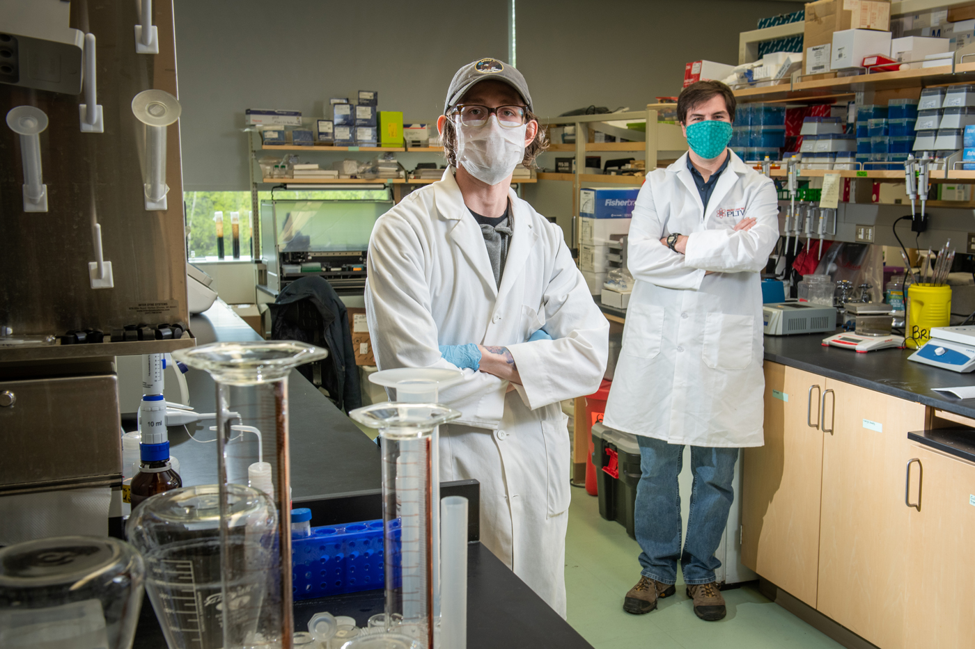 Biological sciences grad student Tyler Fox and Professor Brandon Briggs are making viral transport media to supply Alaska's COVID-19 testing centers in UAA's new Advanced Instrumentation for Microbiome Studies (AIMS) core facility in the ConocoPhillips Integrated Science Building.