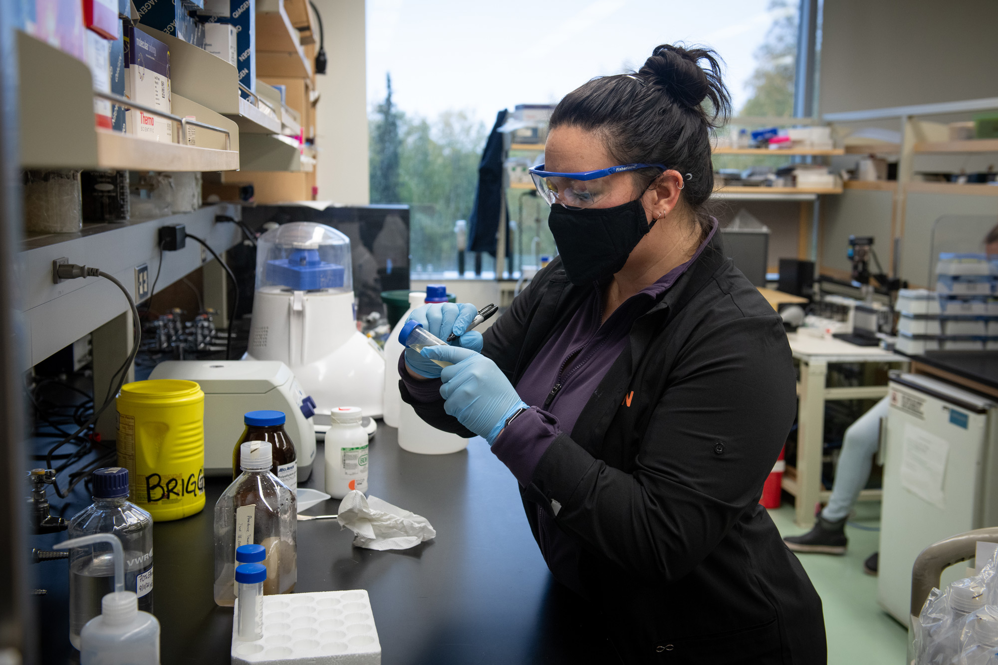 Biology and natural sciences senior Kodi Haughn prepares samples of wastewater for COVID-19 testing in Professor Brandon Briggs' lab in UAA's ConocoPhillips Integrated Science Building. (Photo by James Evans / University of Alaska Anchorage)