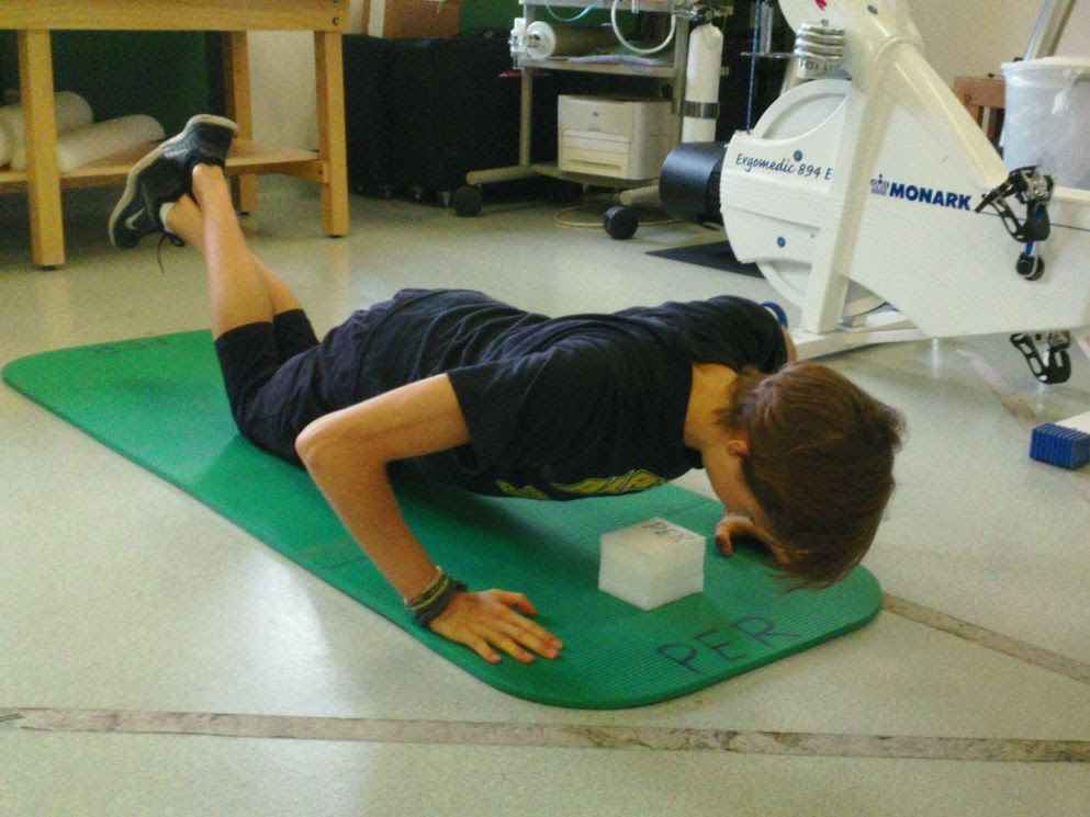 Person doing a push-up to test muscular endurance at UAA's Human Performance Lab