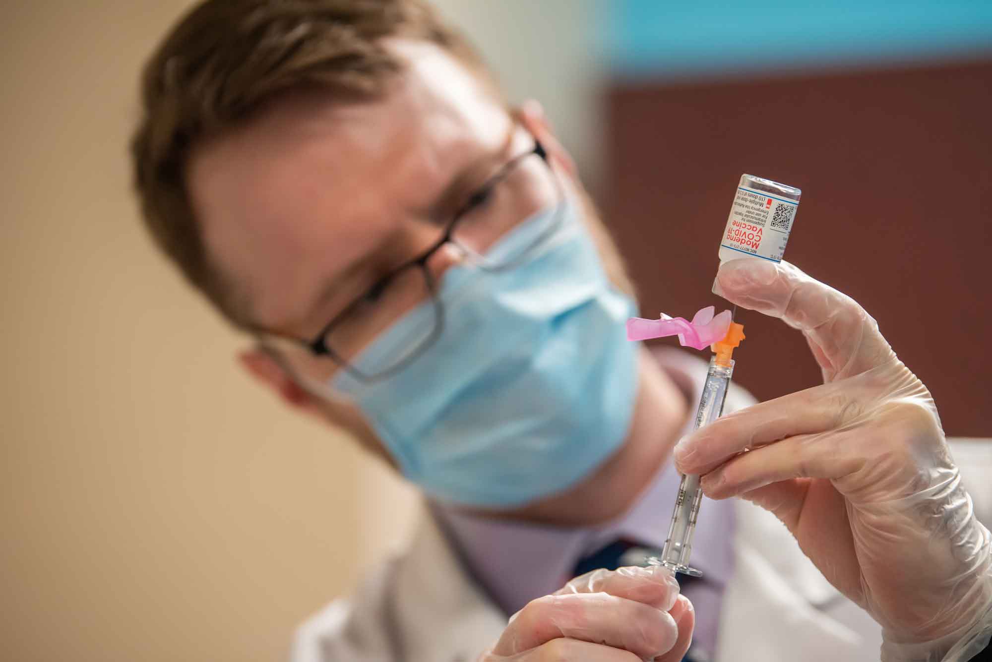 A UAA/ISU Doctor of Pharmacy student prepares a dose of the COVID-19 vaccine.