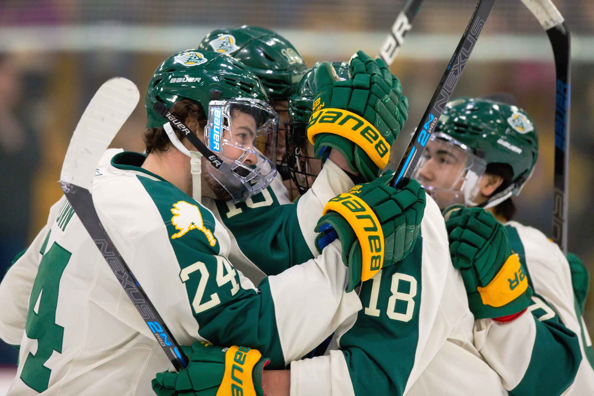 UAA hockey team celebrates with a team huddle (Photo courtesy UAA Athletics)