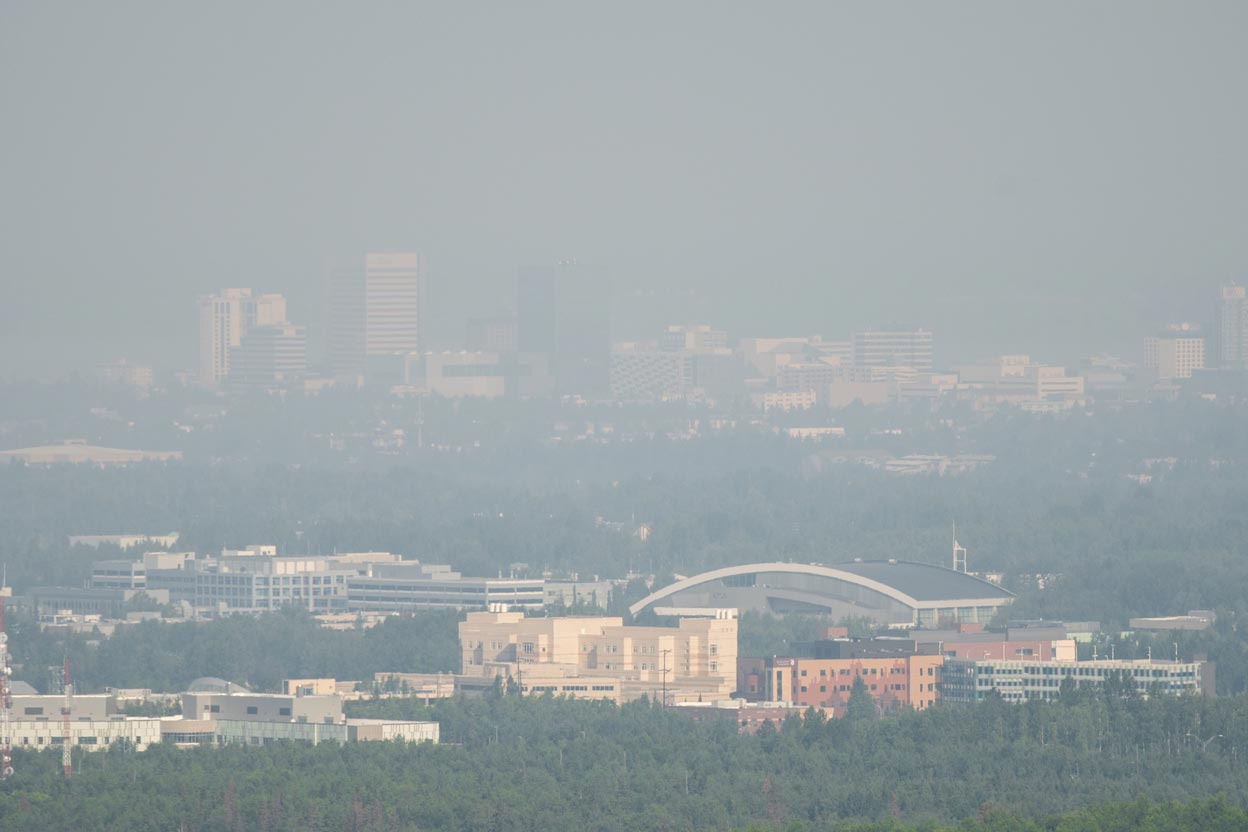 Anchorage skyline obscured by smoke from Swan Lake wildfire