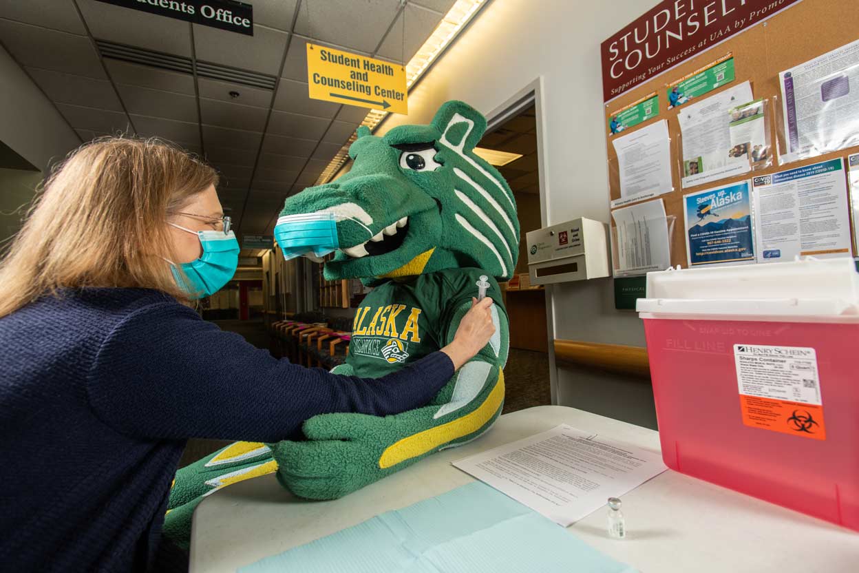UAA's Spirit gets his COVID-19 vaccination at the Student Health and Counseling Center in Rasmuson Hall.
