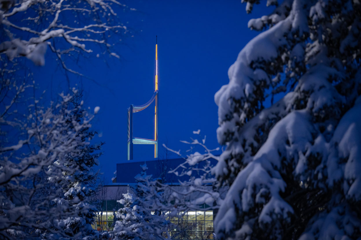 The beacon of knowledge atop UAA's Consortium Library shines on a snowy morning.