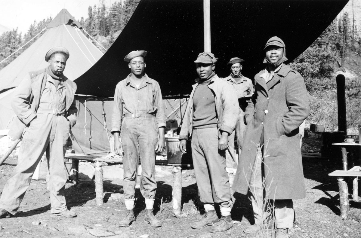 Photograph of five African-American soldiers who took part in the construction of the Canadian portion of the Alaska Highway. (Alaska and Polar Regions Collections, Elmer E. Rasmuson Library, University of Alaska Fairbanks)