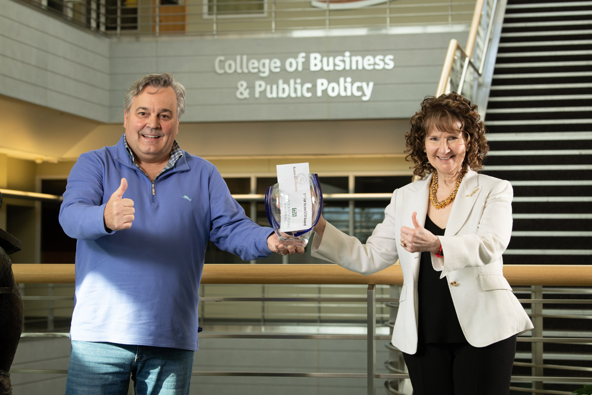 Competition organizer and chair UAA Professor of Entrepreneurship Dr. Helena Wisniewski with Competition Judge Jim Kostka, Chief Operating Officer and Owner Alaskan Data Solutions after the  College of Business and Public Policy (CBPP) Business Plan Competition "Perfect Pitch" event.