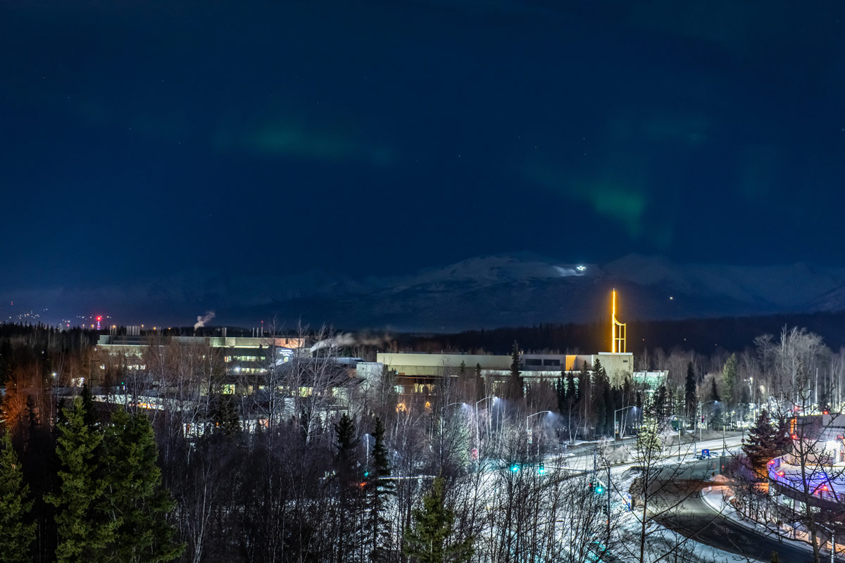 Aurora borealis viewed from UAA's Anchorage campus with Chugach Mountains in the background.