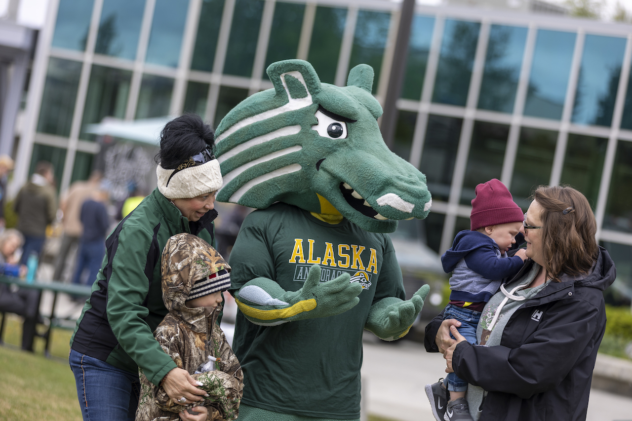 Spirit the Seawolf mingles with fans and concertgoers.