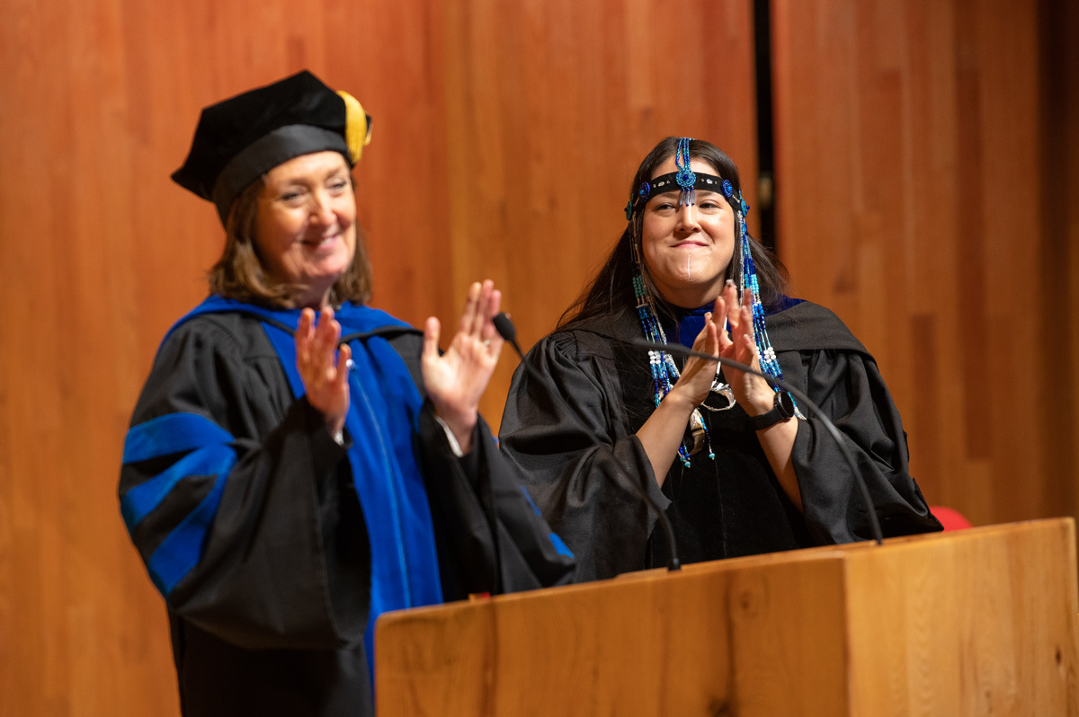 Executive Director for Alaska Native Education & Outreach Michele Yatchmeneff and Provost Denise Runge officiate UAA's spring Commencement awards ceremony in the Fine Arts Building recital hall.
