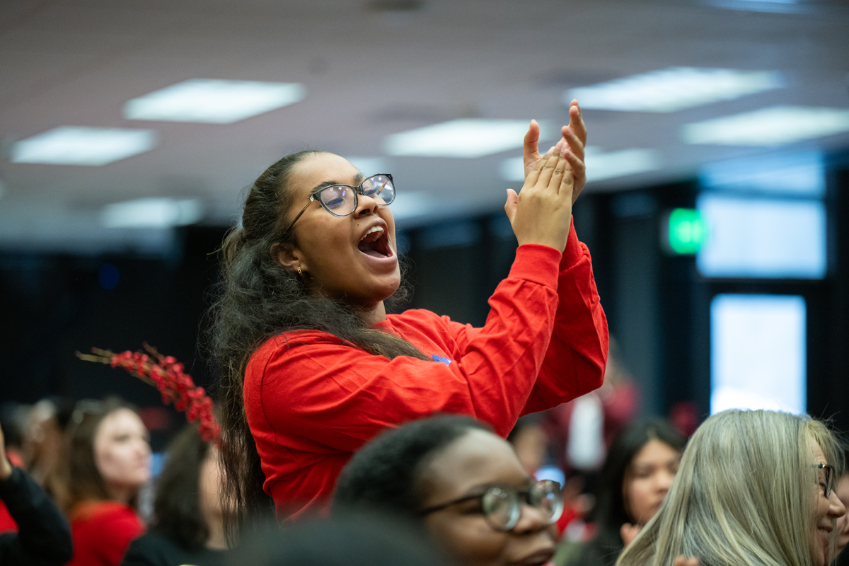 TRIO student applauds during the 2024 TRIO Day celebration in the UAA Student Union.