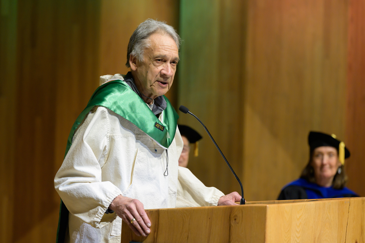 Alvin Amason speaks as he receives the Honorary Degree Award.