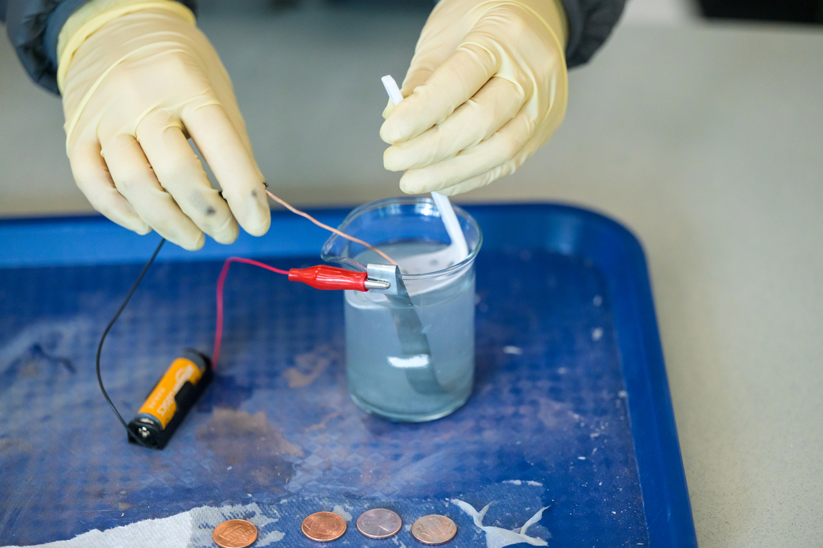 Middle school students learn to electroplate pennies as UAA mechanical engineering professor Raghu Srinivasan teaches a UAA Summer Engineering Academy focusing on corrosion chemistry in UAA's Engineering and Computation Building.