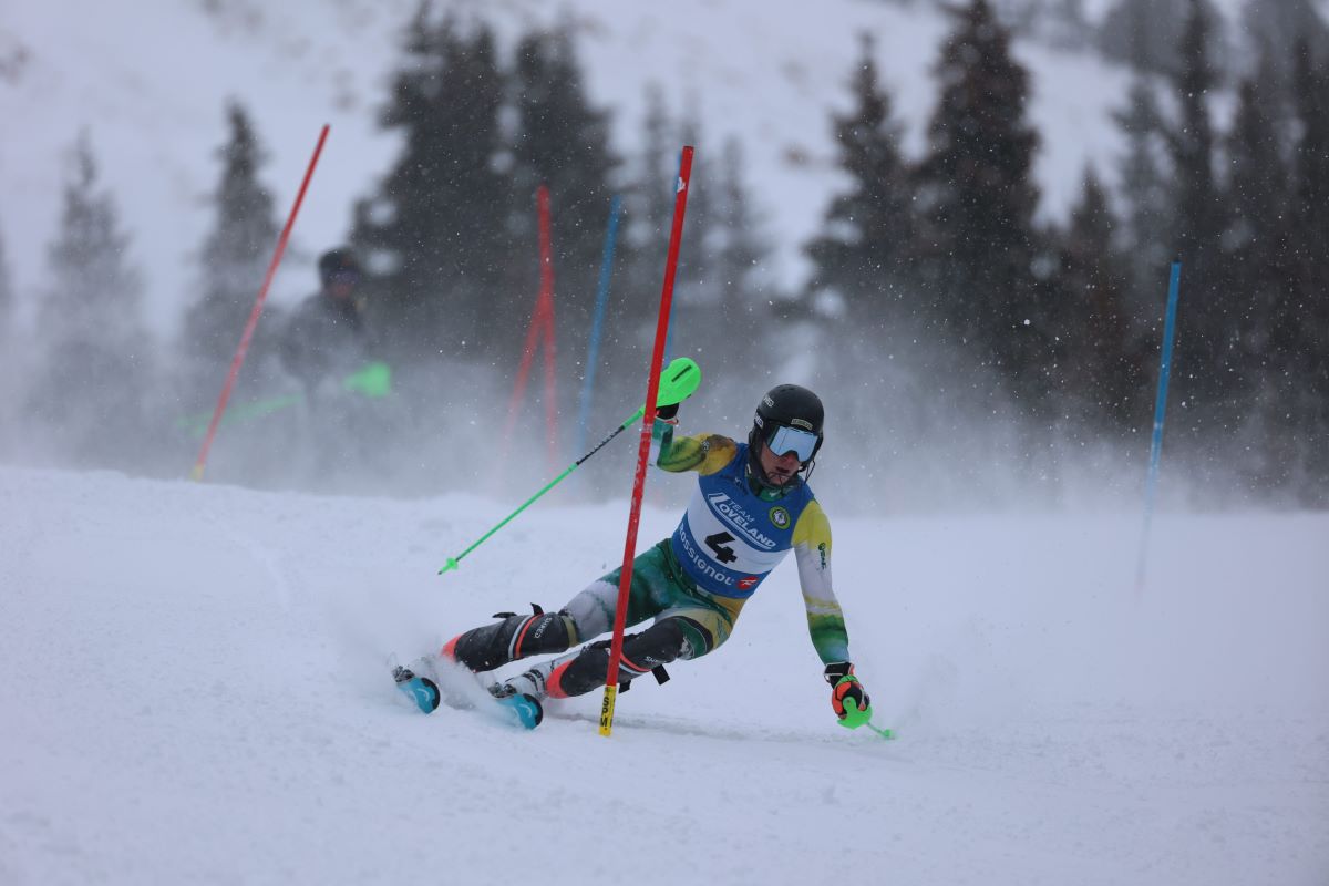 A UAA skier skiing on a slope