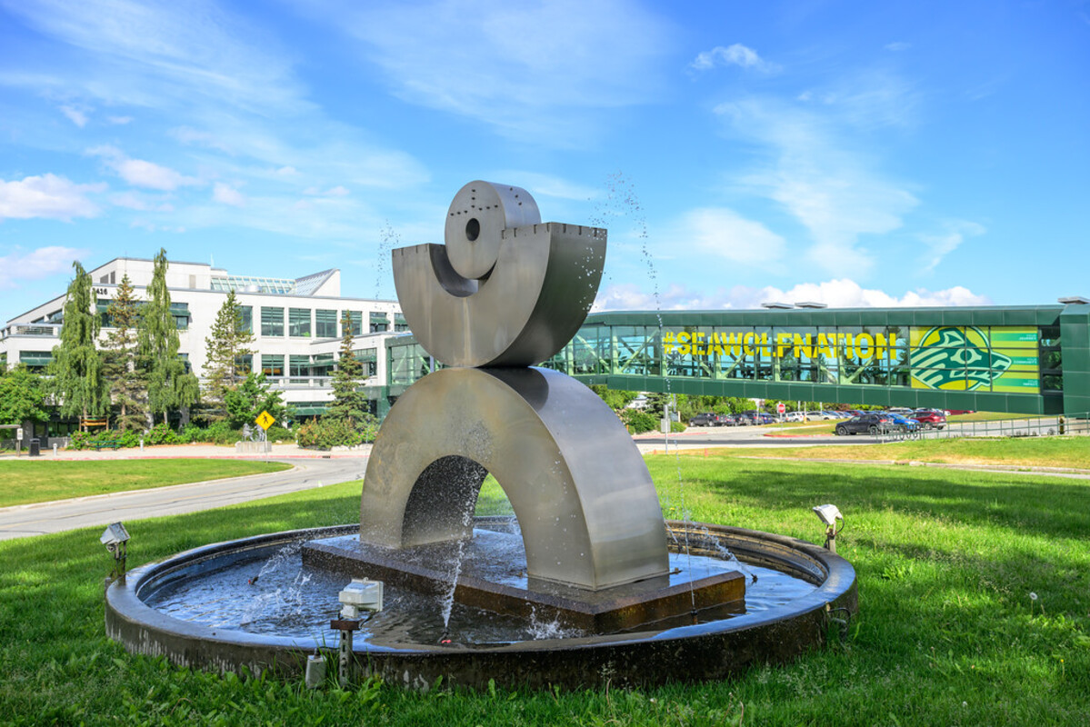 William Yashiburo Kimura's Balanced Arc sculpture on the UAA quad on a summer morning.