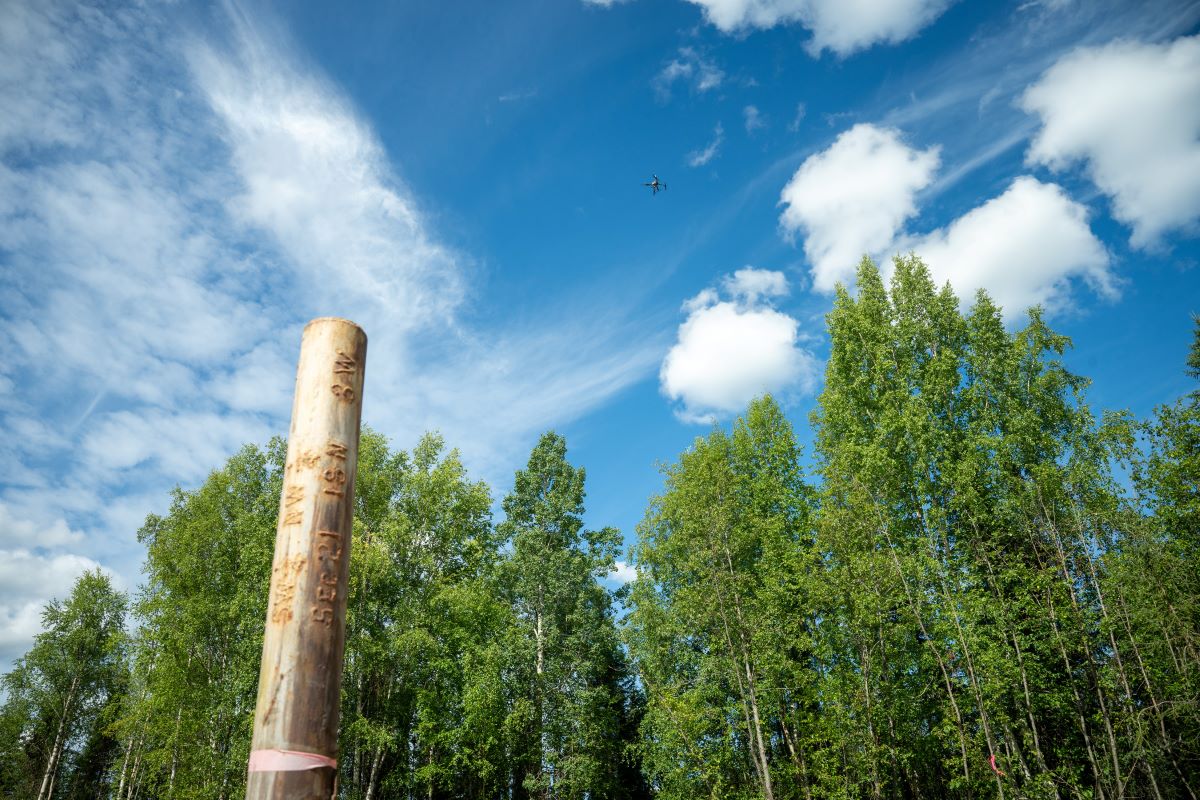 a drone flying over an oil well