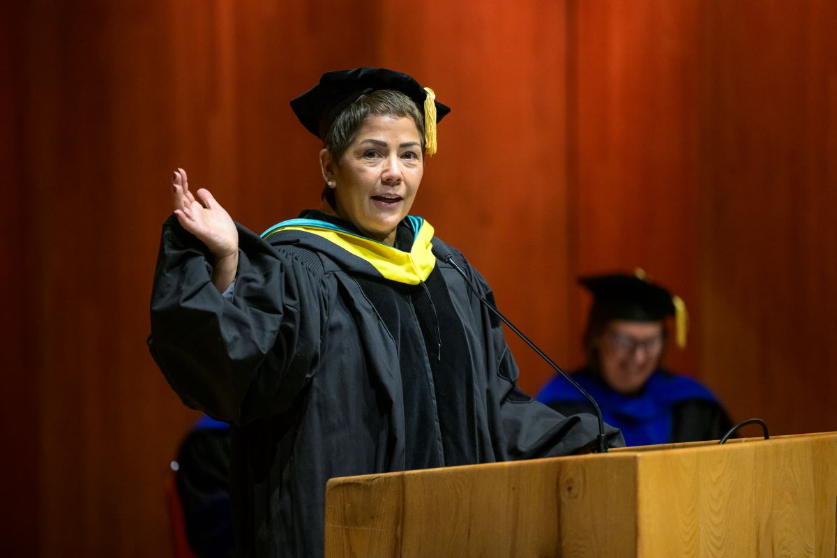 Sophie Minich at a lecturn