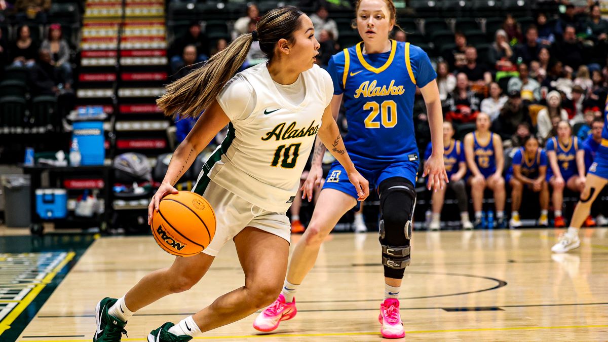 Jennifer Nash playing basketball against UAF