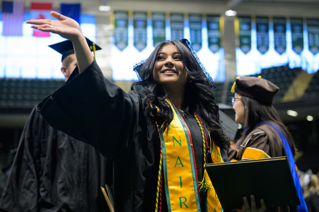 Commencement student speaker Maisha Chowdhury, HLSC BS, at UAA's Fall 2025 Commencement in the Alaska Airlines Center.