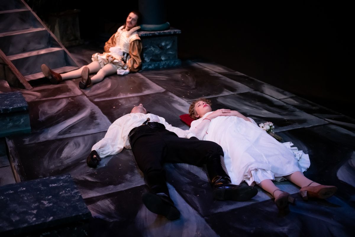 Romeo, Juliet and Paris lay dead in a Shakespeare stage play
