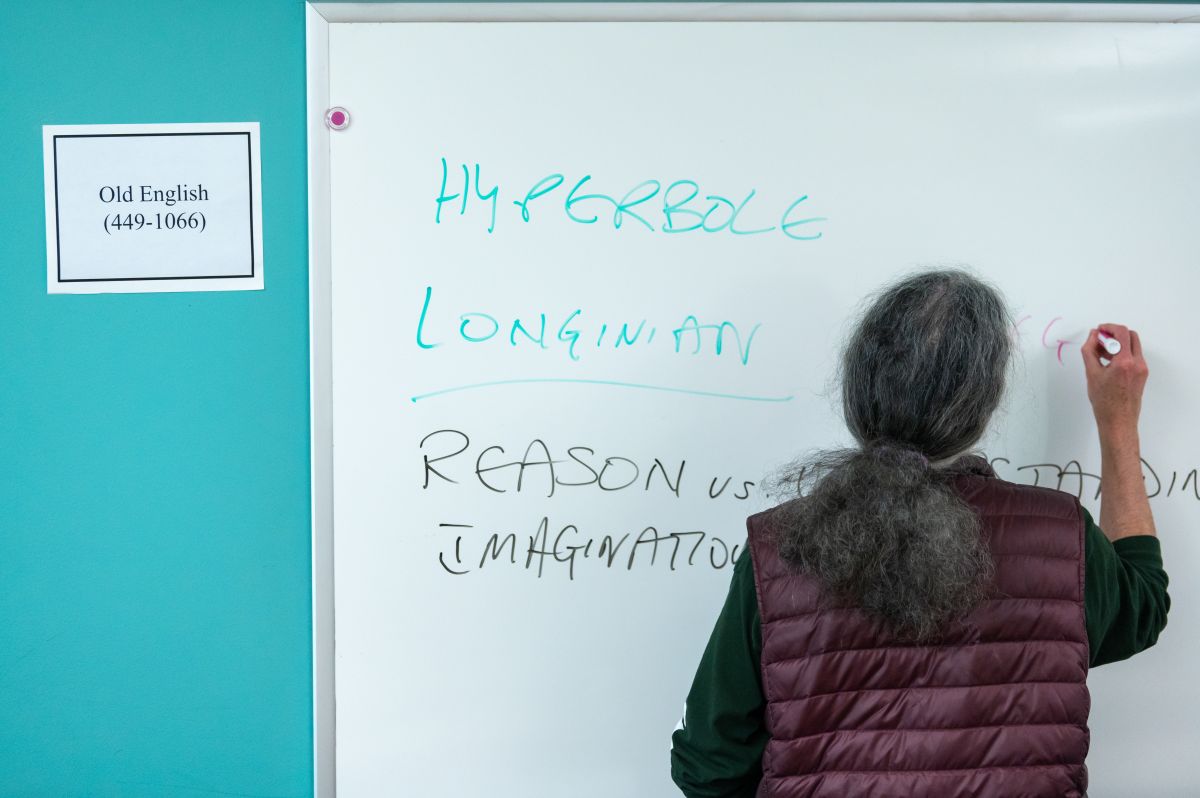 Professor Toby Widdicombe writing on a white-board