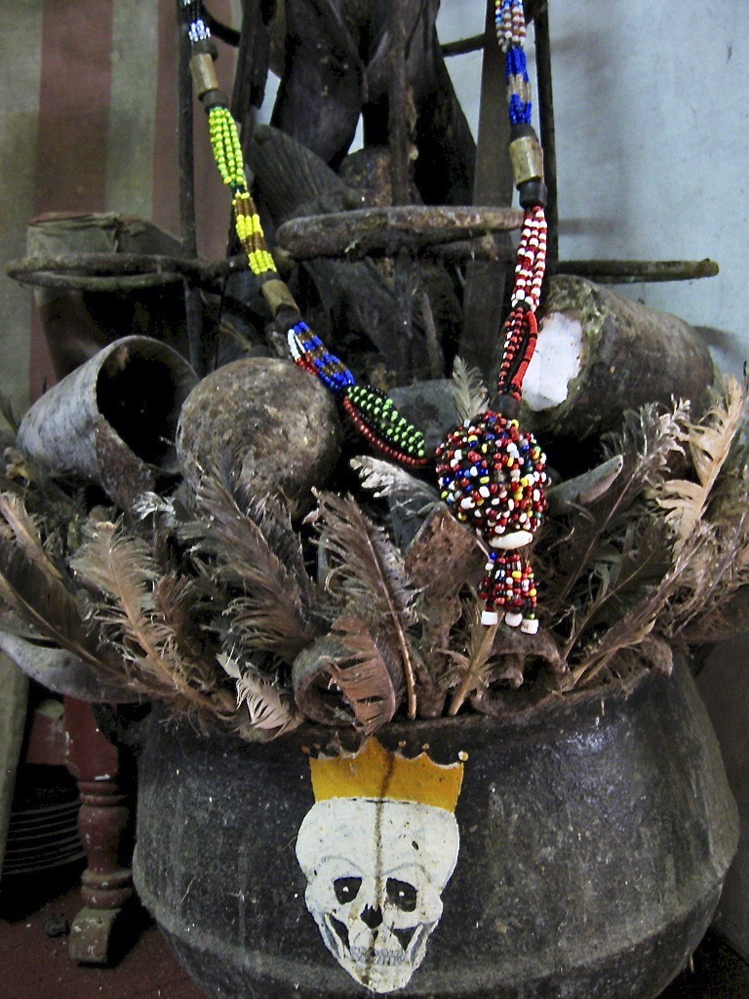feathered pot alter with a skull drawing