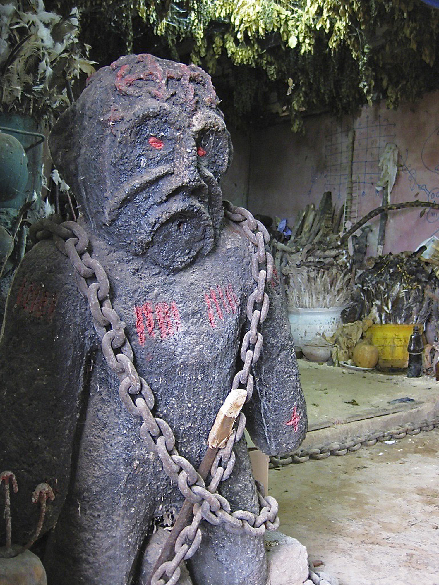 Stone figure chained down